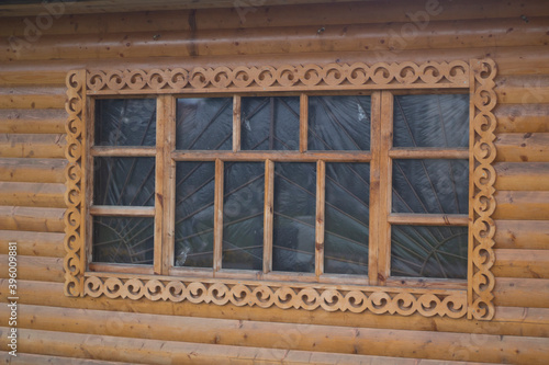 Wooden window with platband. Patterned platband made of wood © Олег Копьёв