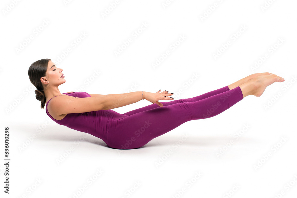 Beautiful athletic woman gymnast in sportswear doing fitness exercises on a white background Beautiful athletic woman gymnast in sportswear doing fitness exercises on a white background