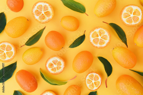 Fresh ripe kumquat fruits, colorful bright orange citrus background 