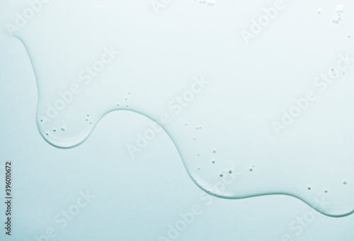 Photographie Cream gel gray blue transparent cosmetic sample texture with bubbles background