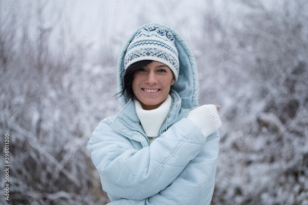 Portrait of a beautiful young smiling girl. Snow background. Sensual.
Portrait of a beautiful young smiling girl. Snow background. Sensual.