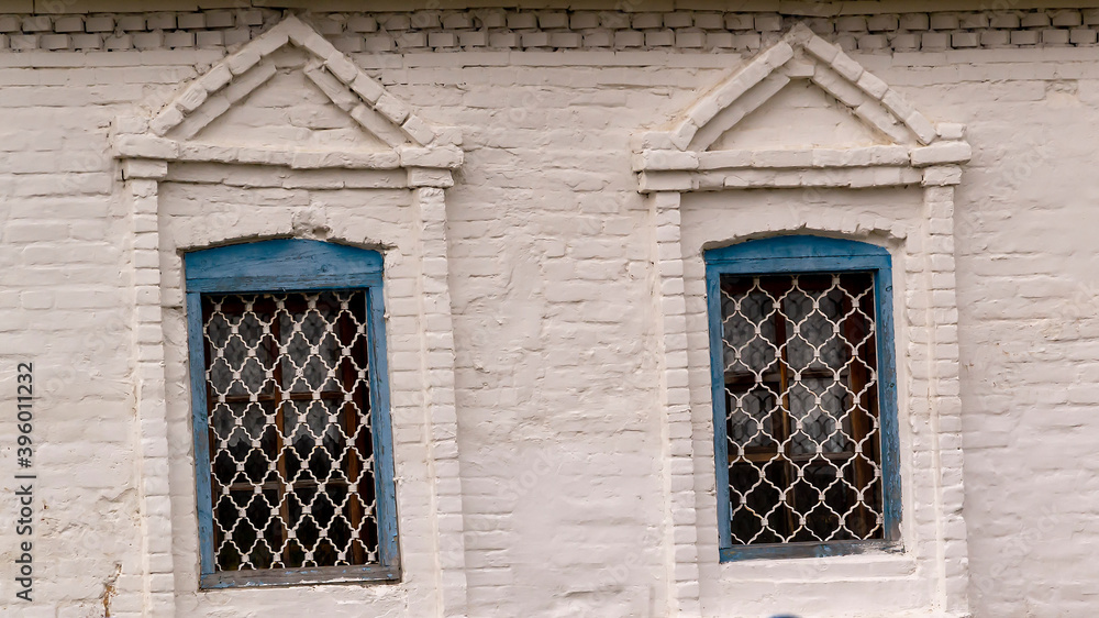 Fototapeta premium Windows in a brick wall