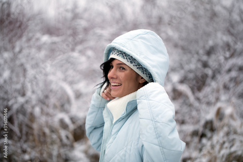 Outdoor close up portrait of young beautiful happy smiling girl. Woman winter day. 