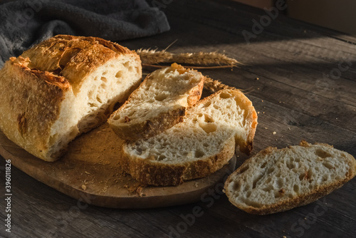 Various rustic bread on a wooden board. Healthy food and farming concept