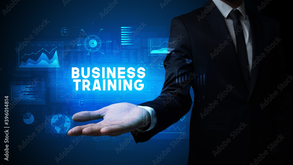 Obraz premium Hand of Businessman holding BUSINESS TRAINING inscription, business success concept