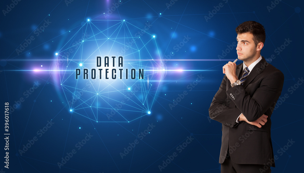 Businessman thinking about security solutions with DATA PROTECTION inscription Businessman thinking about security solutions with DATA PROTECTION inscription