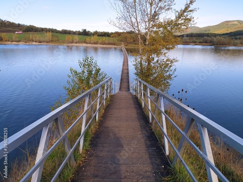 wooden bridge over lake © Ricox