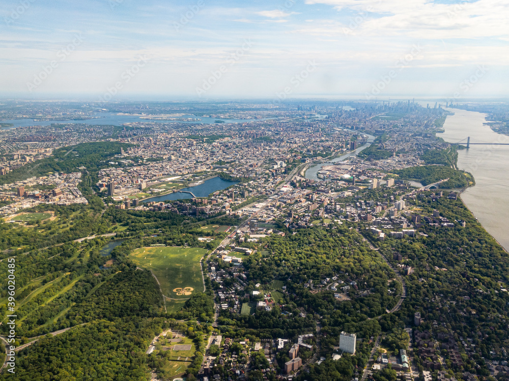 Aerial view of Bronx, New York City with Manhattan and Brooklyn in the distance, facing south