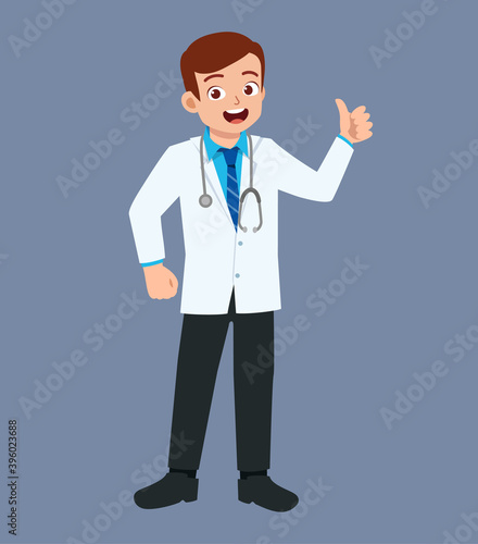nice good looking young doctor standing and show thumb up