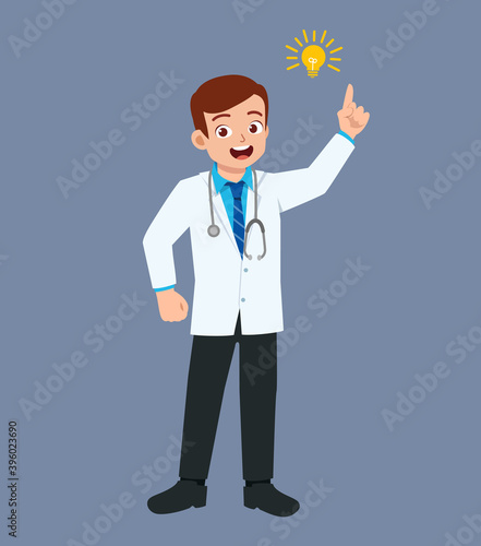 nice good looking young doctor standing with light bulb sign