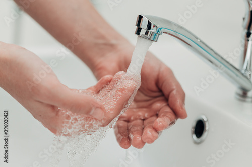 The Girl Washes Her Hands to Avoid Infection With the Virus COVID-19