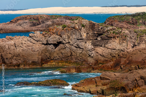 The brown Rocks and Sand Dunes at Birubi Point in regional Australia