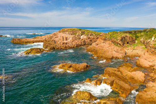 The brown Rocks and Tasman Sea at Birubi Point in regional Australia photo