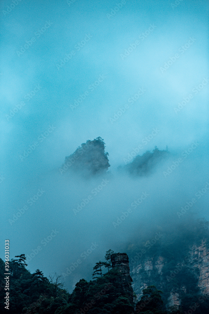Amazing landscape of mountain and forest in the foggy at Wulingyuan, Hunan, China. Wulingyuan Scenic and Historic Interest Area which was designated a UNESCO World Heritage Site in China