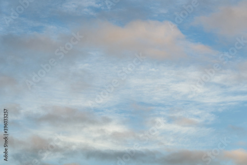 Peaceful evening sky in bands of white and blue, as a nature background 