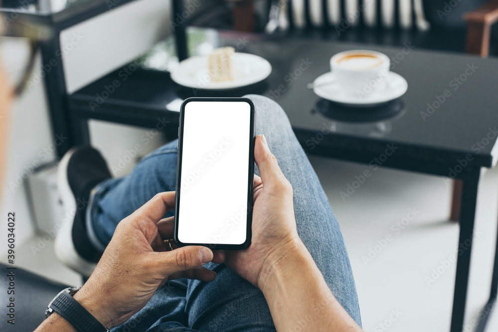 cell phone blank white screen mockup.man hand holding texting using mobile on desk at office.background empty space for advertise.work people contact marketing business,technology cell phone blank white screen mockup.man hand holding texting using mobile on desk at office.background empty space for advertise.work people contact marketing business,technology