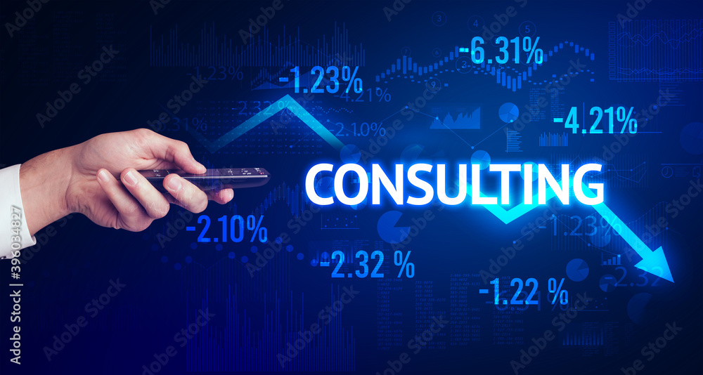 male hand holding wireless peripheral with CONSULTING inscription, modern business concept male hand holding wireless peripheral with CONSULTING inscription, modern business concept