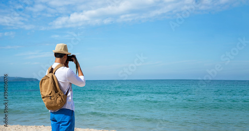 Happy lifestyle asian  man in sea beach, relax on the beach in summer. Travel Concept © tonjung