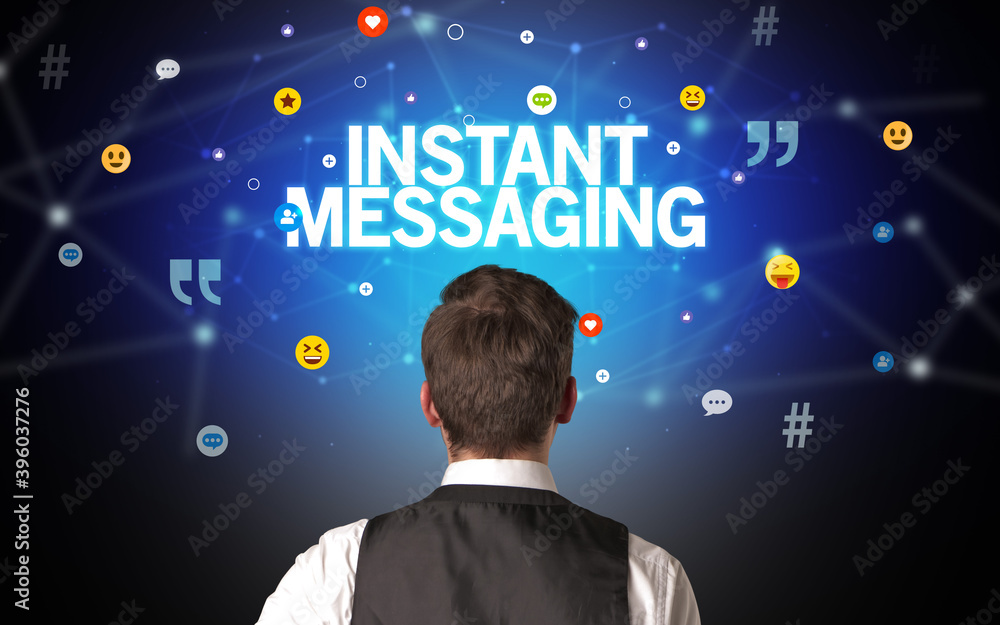 Rear view of a businessman with INSTANT MESSAGING inscription, social networking concept Rear view of a businessman with INSTANT MESSAGING inscription, social networking concept