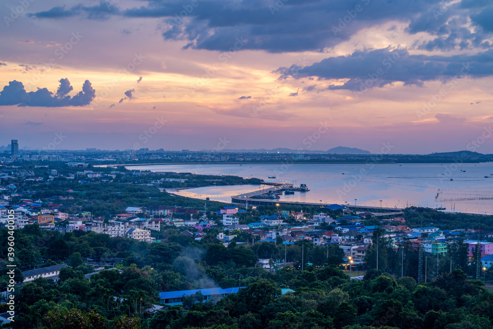 Fototapeta premium Beautiful sunset landscape view of fisherman village light trail and bridge at Bang Sai district Chonburi Thailand
