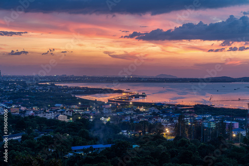 Beautiful sunset landscape view of fisherman village light trail and bridge at Bang Sai district Chonburi Thailand