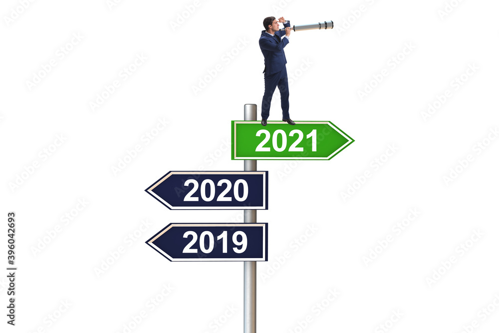 Road sign and businessman with 2020 and 2021 Road sign and businessman with 2020 and 2021