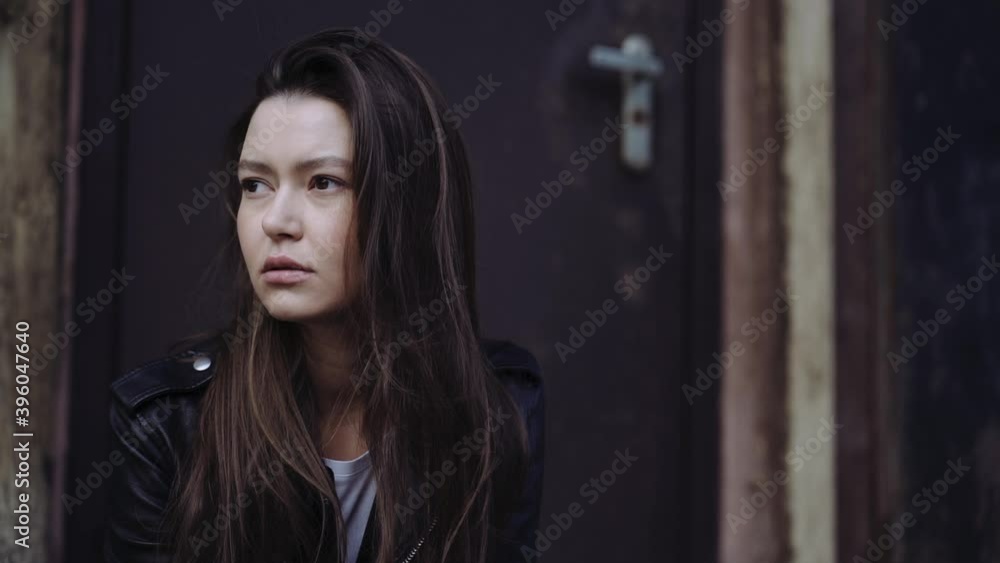 portrait of a girl against the background of an old building, concept of urban environment, loneliness or waiting portrait of a girl against the background of an old building, concept of urban environment, loneliness or waiting