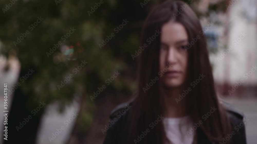 girl walking in the city on the background of the old city, urban environment concept, loneliness or waiting for urbanism and street style girl walking in the city on the background of the old city, urban environment concept, loneliness or waiting for urbanism and street style