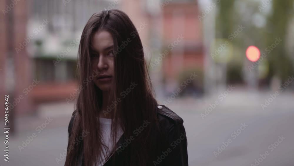 girl walking in the city on the background of the old city, urban environment concept, loneliness or waiting for urbanism and street style girl walking in the city on the background of the old city, urban environment concept, loneliness or waiting for urbanism and street style