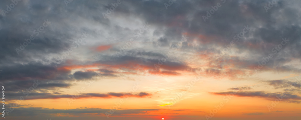 Fototapeta premium Bright and intense Panorama twilight cloudy sky. Evening background image