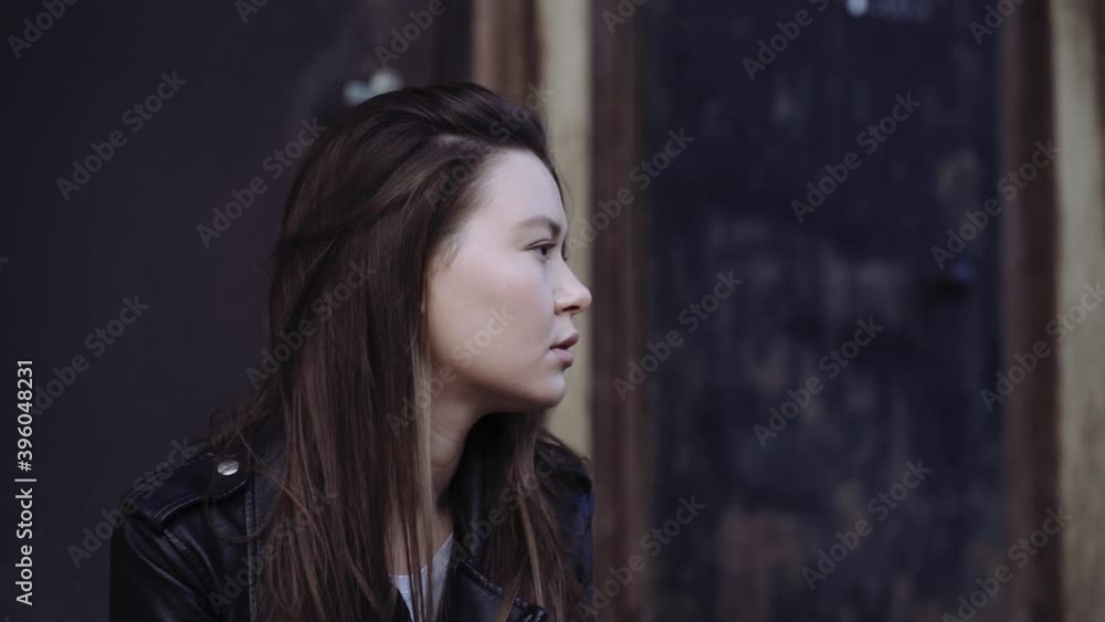 portrait of a girl against the background of an old building, concept of urban environment, loneliness or waiting portrait of a girl against the background of an old building, concept of urban environment, loneliness or waiting