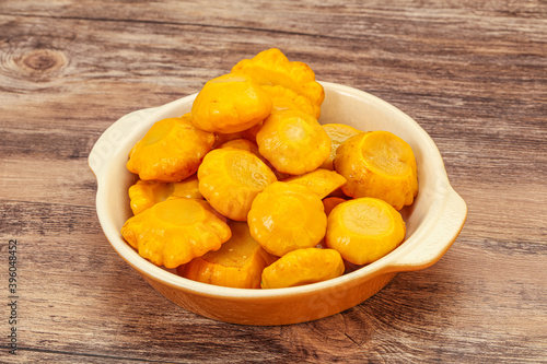 Marinated yellow patisson in the bowl