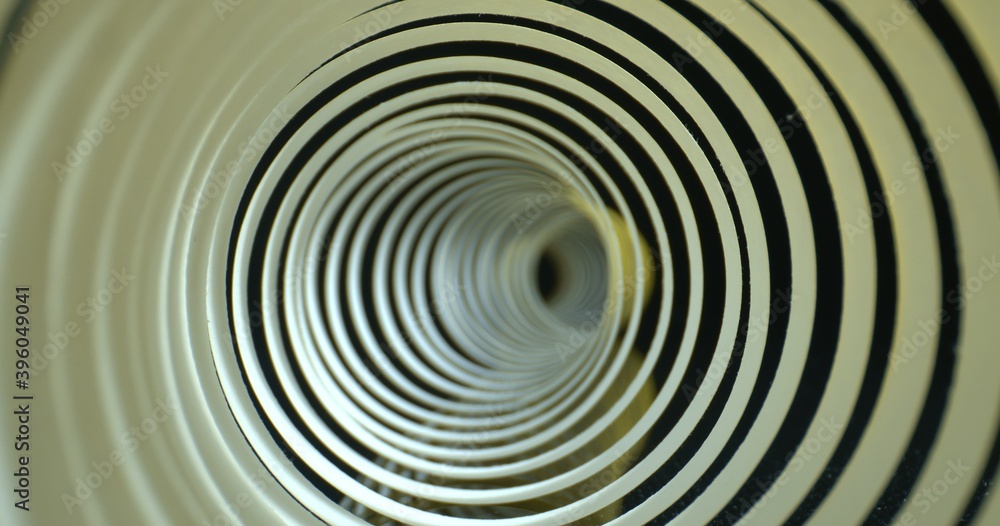 Abstract tunnel shot. Spiral made of paper with soft shadows. Close-up inside spiral paper tape. High quality. Abstract tunnel shot. Spiral made of paper with soft shadows. Close-up inside spiral paper tape. High quality.