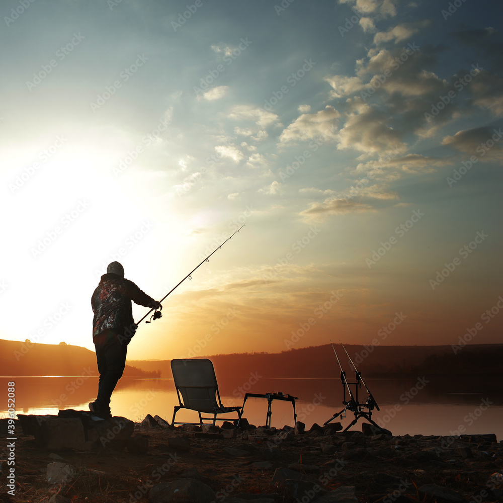 angler carp angler on the lake with fishing rods angler carp angler on the lake with fishing rods