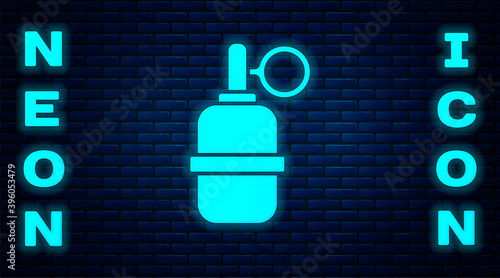 Glowing neon Hand grenade icon isolated on brick wall background. Bomb explosion. Vector.