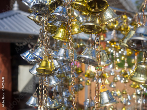 A bell with many silver and gold 