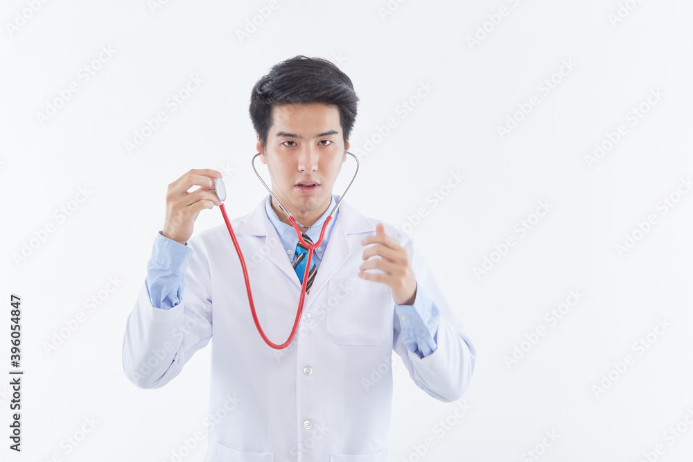 young man doctor posing with a stethoscope young man doctor posing with a stethoscope