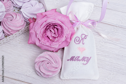 Purple marshmallow and rose in a beautiful festive packaging