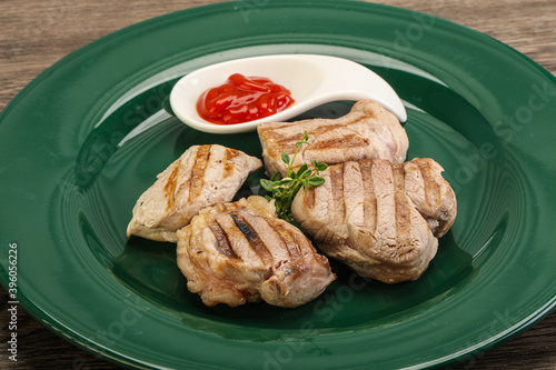 Grilled pork tenderlion with tomato sauce photo