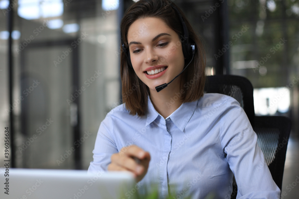 Woman customer support operator with headset and smiling. Woman customer support operator with headset and smiling.