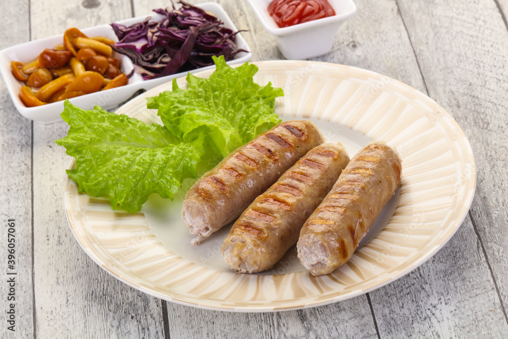 Grilled sausages served mushrooms and cabbage Grilled sausages served mushrooms and cabbage