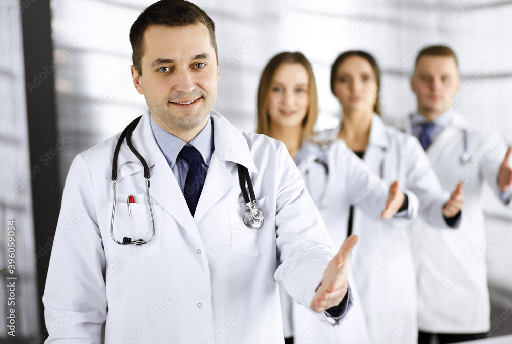 Team of friendly professional doctors are offering their helping hand for the people. Physicians are ready to help their patients. Best medicine concept nowadays Team of friendly professional doctors are offering their helping hand for the people. Physicians are ready to help their patients. Best medicine concept nowadays
