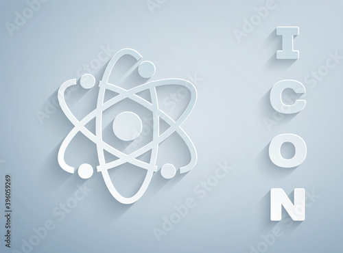 Paper cut Atom icon isolated on grey background. Symbol of science, education, nuclear physics, scientific research. Paper art style. Vector.