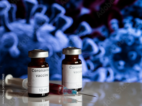 In this photo illustration, vials labelled as Coronavirus vaccine and a syringe photo