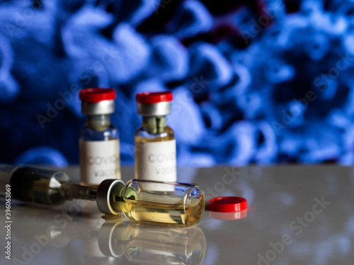 In this photo illustration, vials labelled as Coronavirus vaccine and a syringe photo