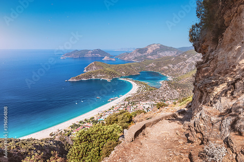 Lycian way trail and famous and popular Turkish resort town of Oludeniz, panoramic view of a fantastic sand beach and a cove with turquoise water. Vacation and beach holiday concept