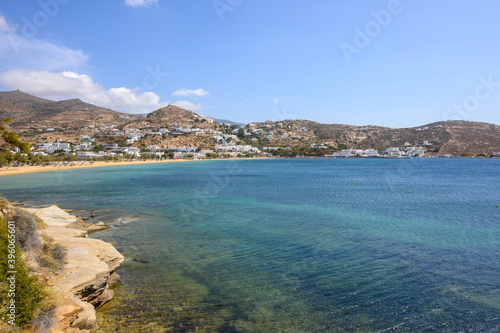 The port of Ios Island in Greece, a picturesque bay with a small settlement and long sandy beach, a famous tourist destination. Cyclades Islands, Greece