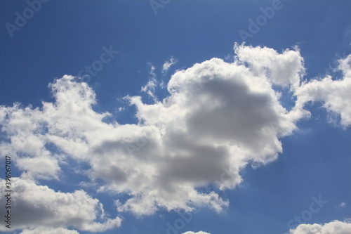 The clouds in the blue sky create fabulous figures that live their own lives, constantly changing and running away from us. A fairy tale that can be seen in the sky.