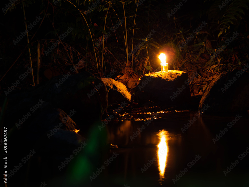 The light of a lamp Reflecting on the stream And shone onto stone and grass The light of a lamp Reflecting on the stream And shone onto stone and grass