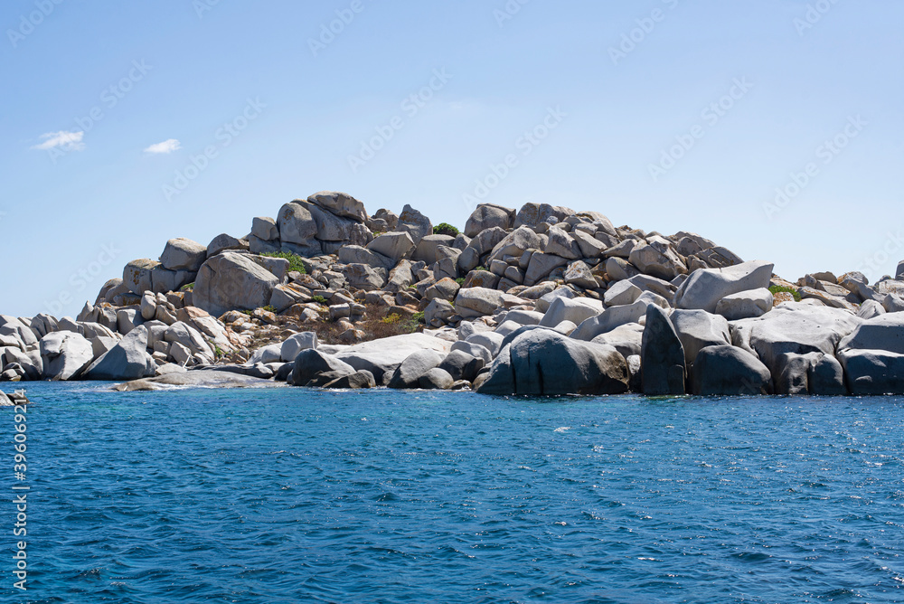 Fototapeta premium View of many large magnificent rocks of the Lavezzi islands in southern Corsica after Bonifacio, a short tour by tourist boat to arrive on the beach with turquoise water